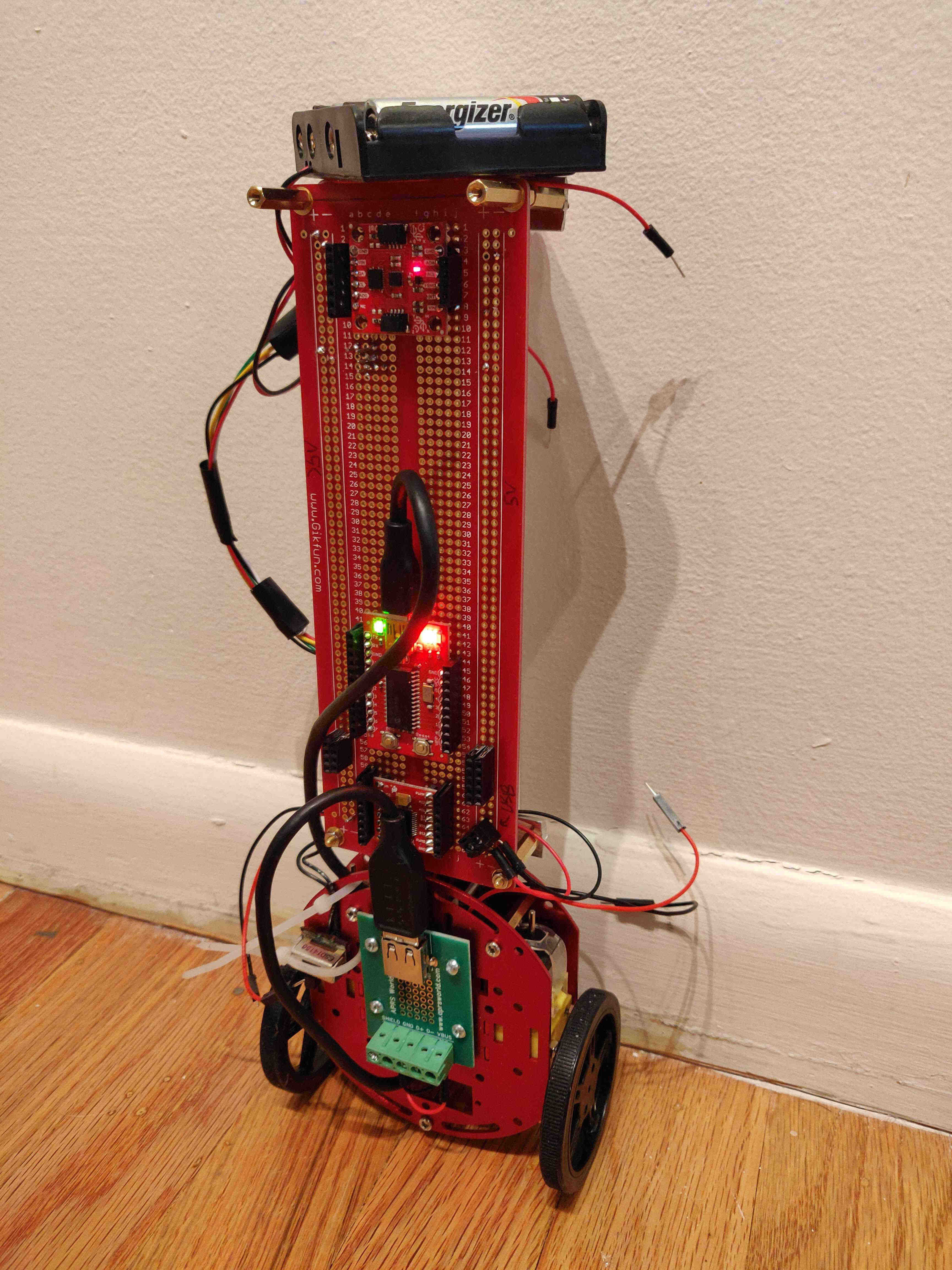 Early tipsy.bot chassis standing up semi-autonomously (e.g. leaning against the wall)